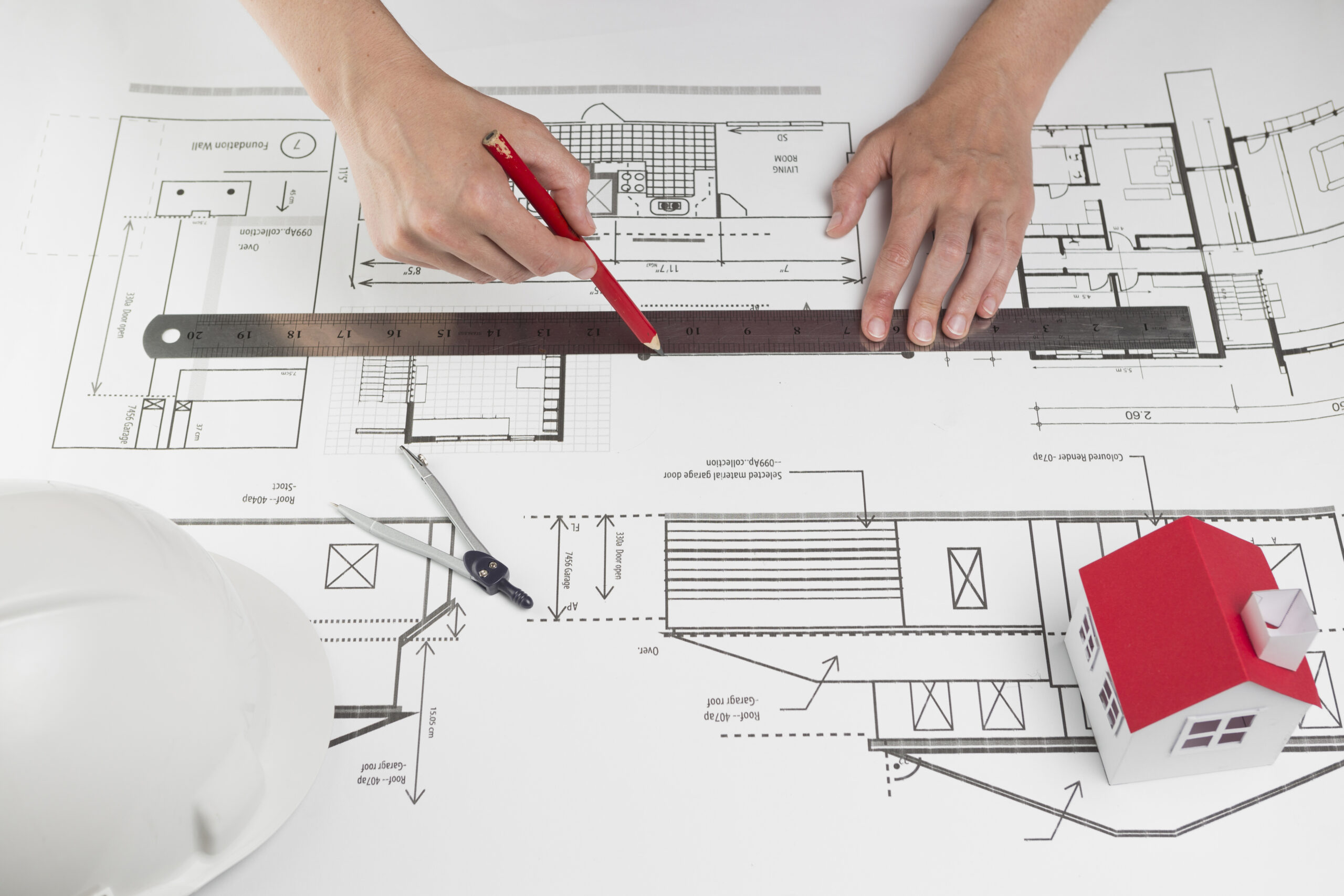 close-up-human-hand-drawing-line-blueprint